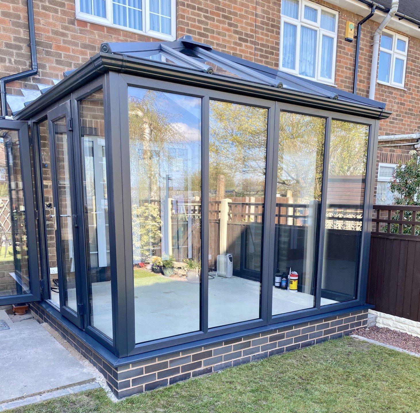 Modern glass conservatory with black frame