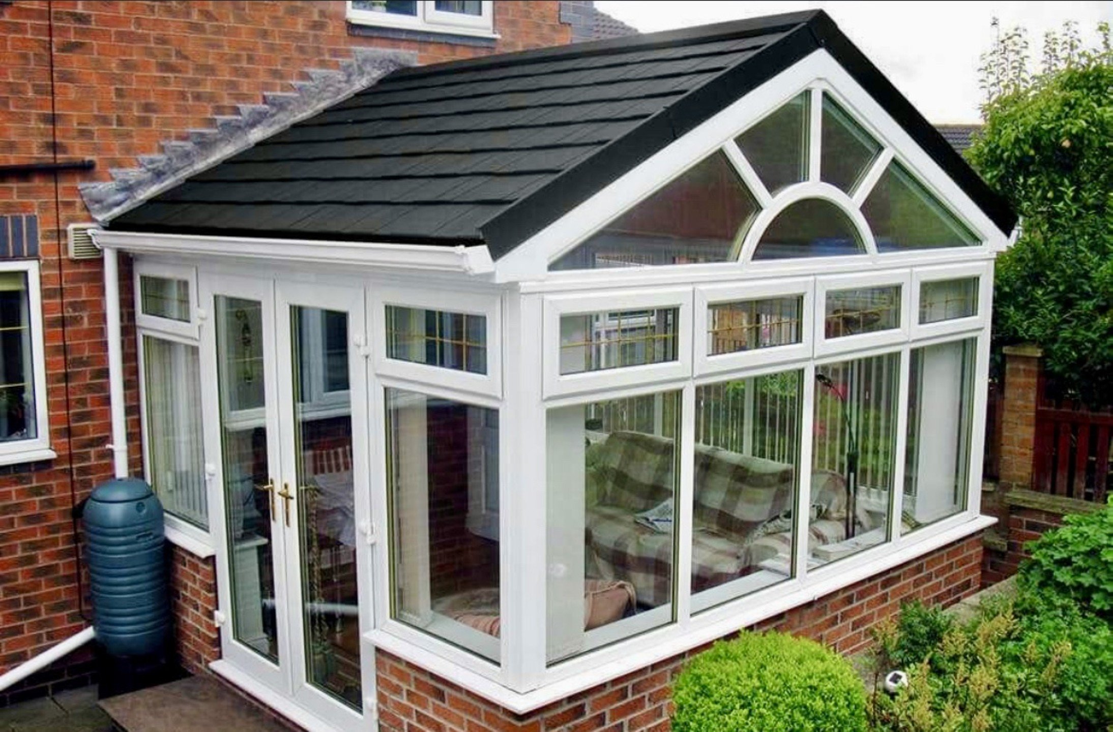 Modern conservatory with glass walls.