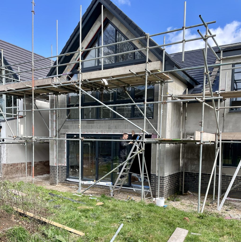 House under construction with scaffolding.