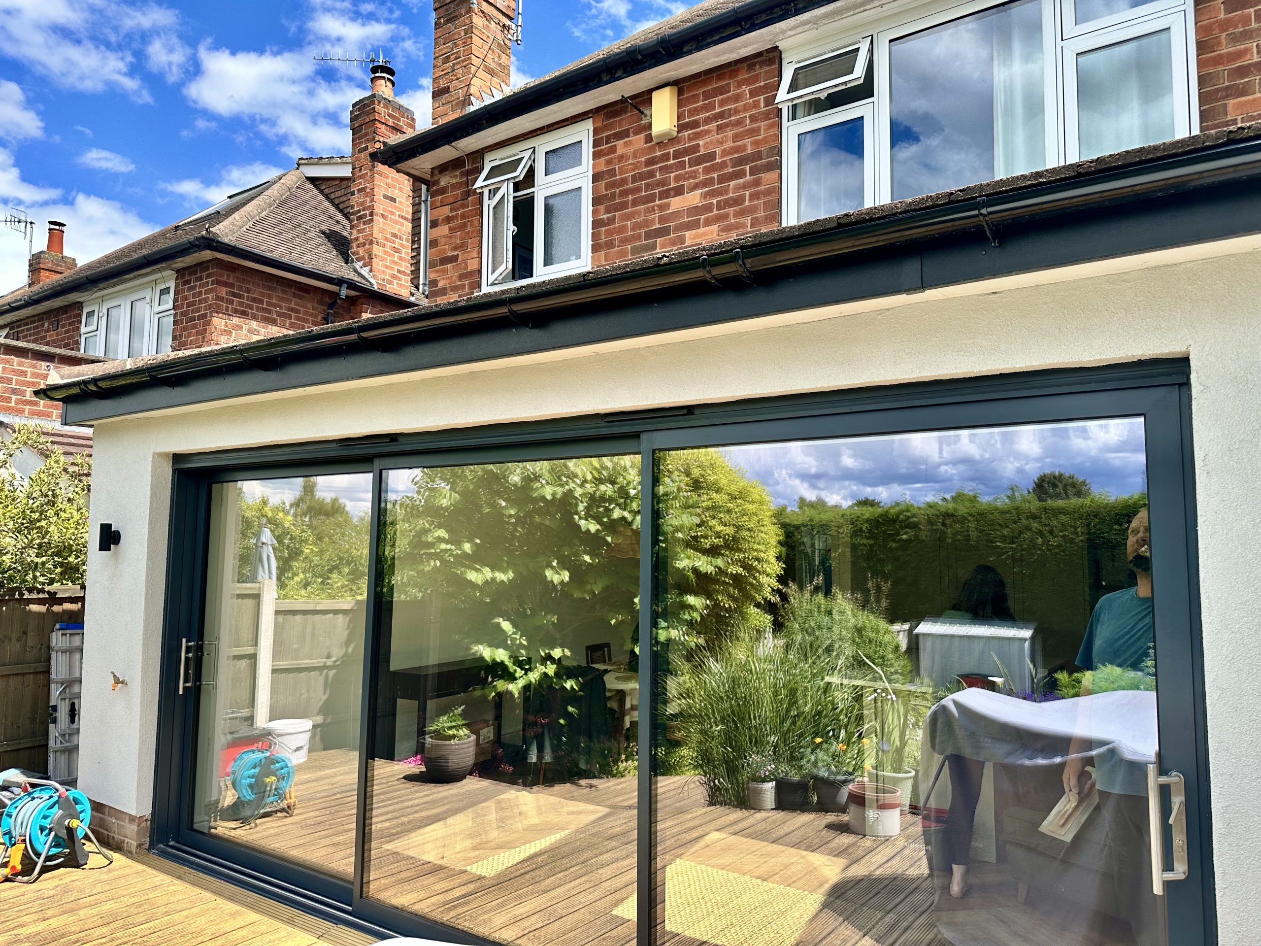 Modern home Extension with large glass doors.
