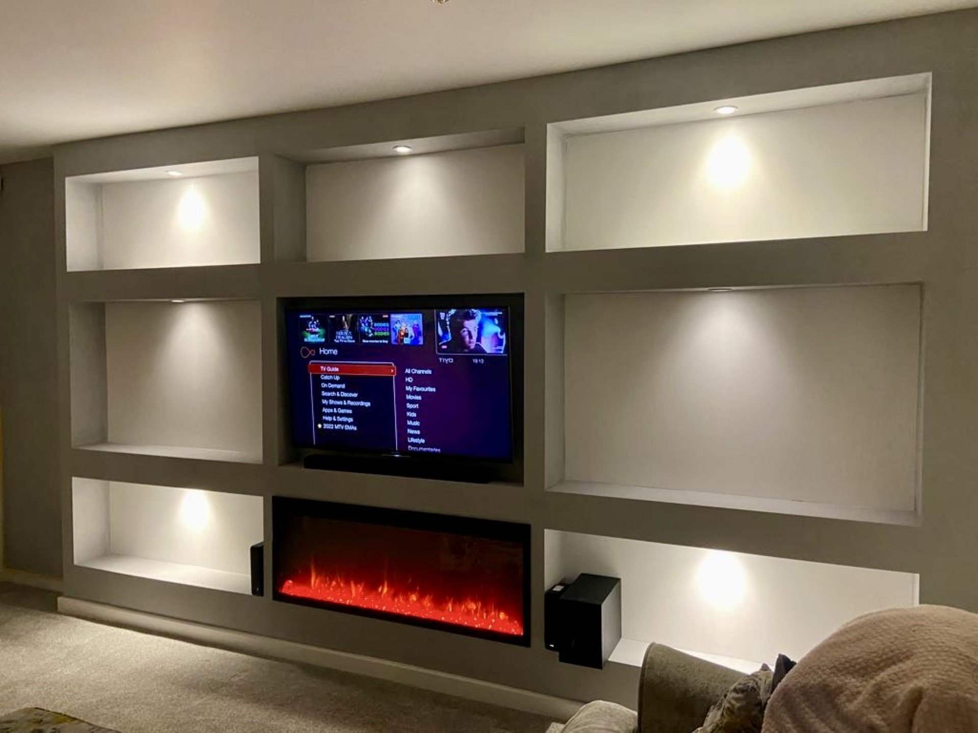 Modern entertainment wall with lighting.